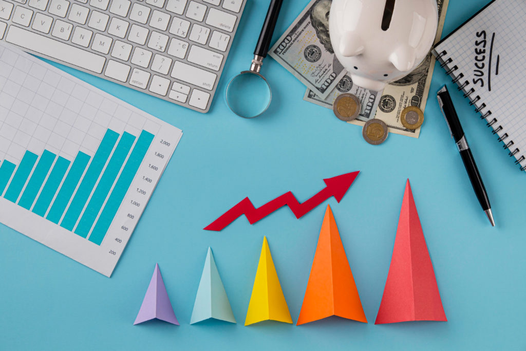 top view business items with growth chart colored cones