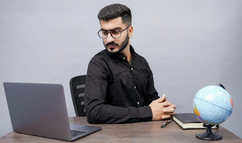 man spotting SEO problem on laptop